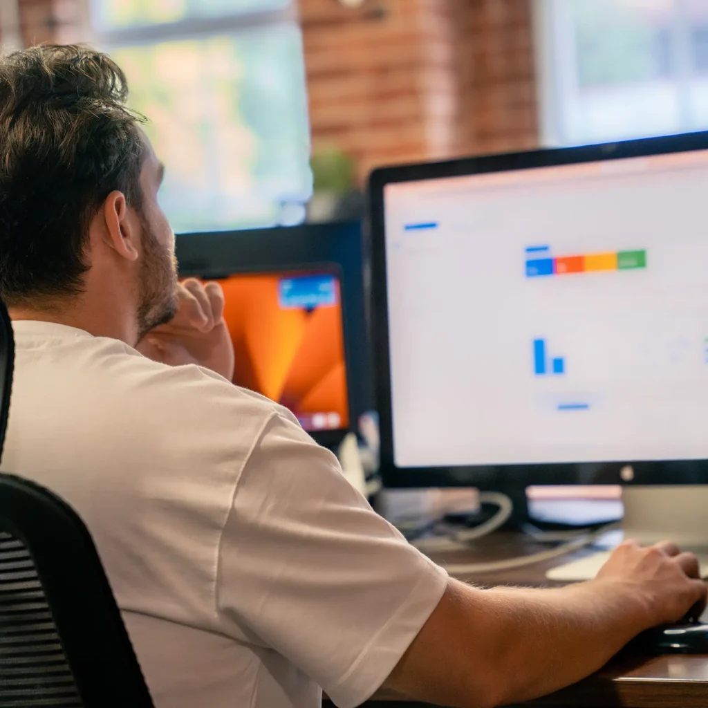 Close-up of a screen showing paid search campaign dashboards with charts and metrics, representing PPC advertising and analytics work.