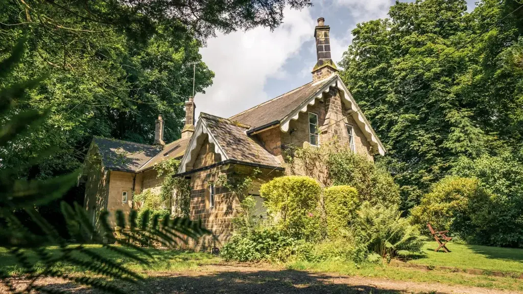 An external shot of a wonderful stone building in green surroundings, proudly displayed in our work on the website