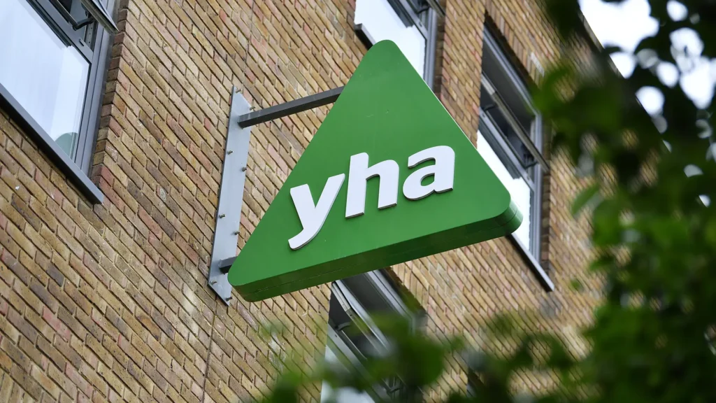 A YHA building with a branded sign attached to it