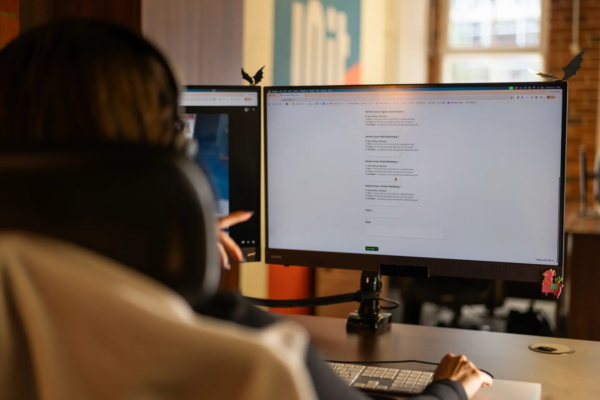 Chloe sat at her desk pointing at her computer monitor.